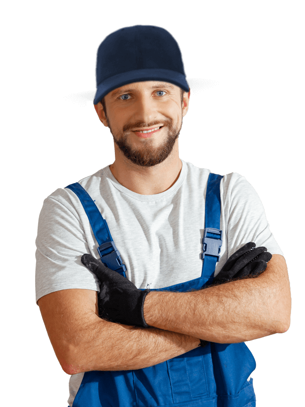 a uniformed and a hat on mechanic crossing his arms and smiling.