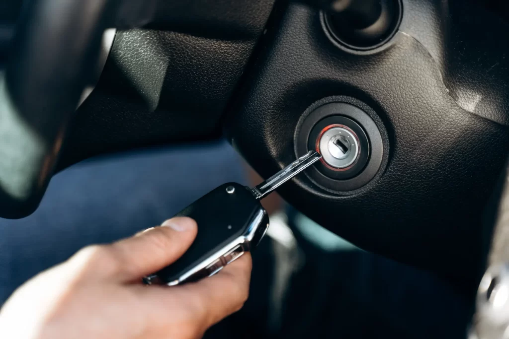 A driver using a spare key of his car.