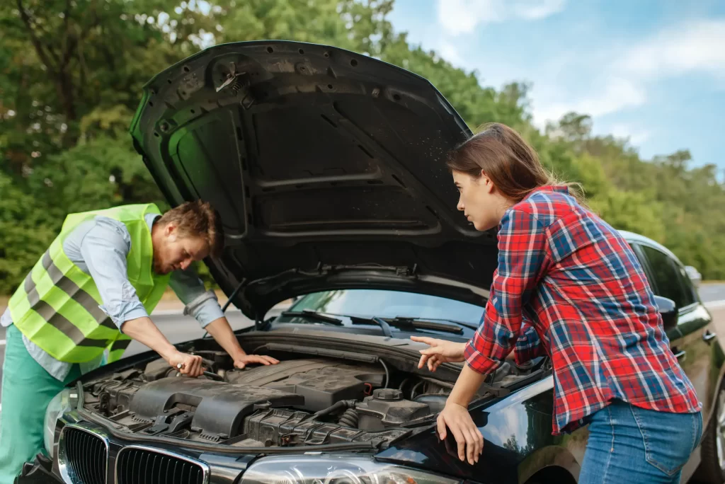 A professional arrives and assists a stranded driver.