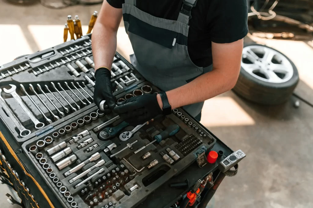 A mechanic showing his box full of advanced tools.