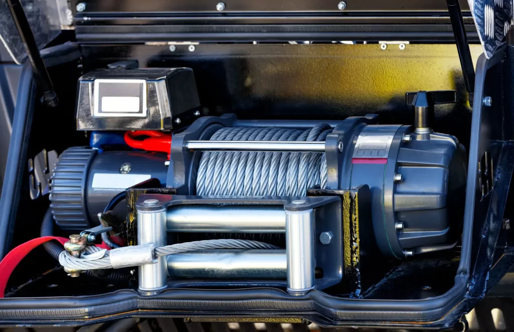 An inside of the tow truck winch out cable ready to tow a car.