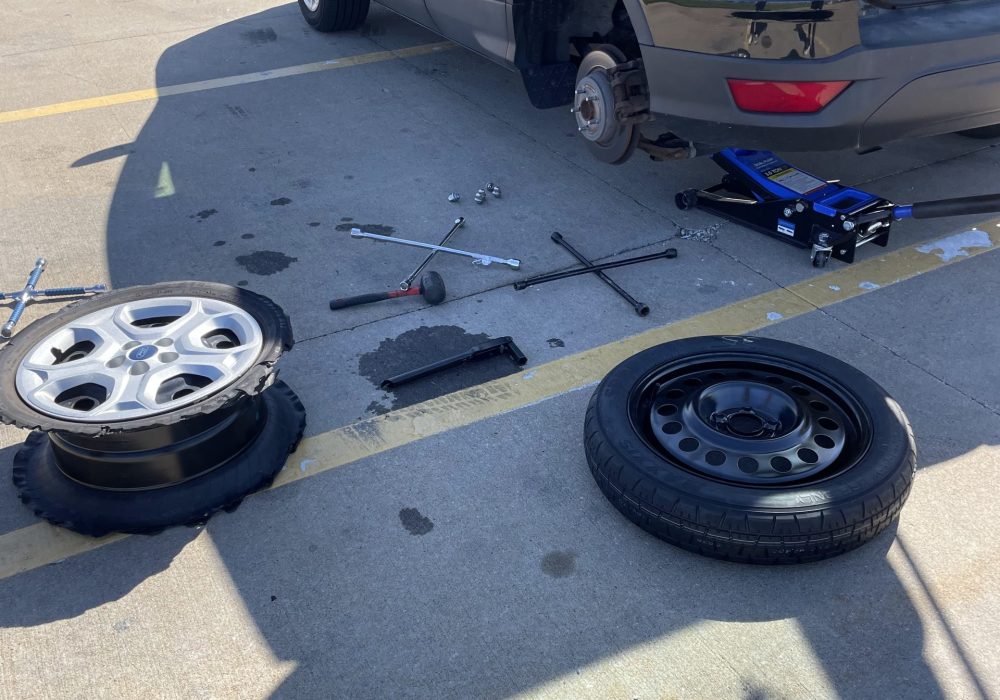 An image of a car performing to change its tires.