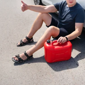 A man ran out of gas lying in the road waiting for the roadside assistance.